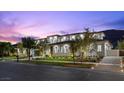 A stylish, two-story home with manicured lawns and stone accents at 42 Ravenswood Ave, Las Vegas, NV 89141
