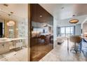 Modern condo featuring an elegant bathroom with marble, a sleek wardrobe, and an open living area with city views at 4381 W Flamingo Rd # 5220, Las Vegas, NV 89103