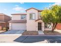 Charming two-story home with a well-kept lawn, desert landscaping, and an attached two-car garage at 5340 Santa Fe Heights St, North Las Vegas, NV 89081