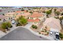An aerial shot of a home with red tile roofing in a well-maintained residential neighborhood at 5526 Spruce Hill Ct, Las Vegas, NV 89148