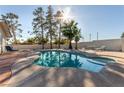 Sparkling pool surrounded by mature trees and patio area, perfect for outdoor entertaining at 5905 Paseo Montana, Las Vegas, NV 89108