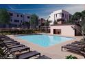 A tranquil community pool is surrounded by lounge chairs and green landscaping, perfect for relaxation and socializing at 646 Spotted Falcon St, Las Vegas, NV 89138