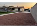 View of backyard with trampoline and perimeter block wall at 706 Red Lake Way, Las Vegas, NV 89110
