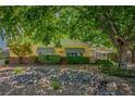 Quaint single-story home with desert landscaping and mature shade trees at 1115 Melville Dr, Las Vegas, NV 89102