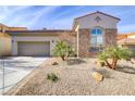Charming home with stone accents, desert landscaping, and a two-car garage at 1223 Casa Palermo Circle Cir, Henderson, NV 89011