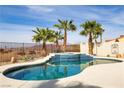 Beautiful pool with an attached spa, mature palms, and desert views at 1223 Casa Palermo Circle Cir, Henderson, NV 89011