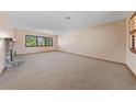 Spacious living room with large windows offering plenty of natural light and neutral decor at 2400 Llewellyn Dr, Las Vegas, NV 89102