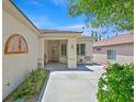 Inviting front porch with seating area, decorative accents, and manicured landscaping at 2839 Goldcreek St, Henderson, NV 89052