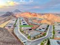 Panoramic street view of homes nestled in the mountains with the address tag at 32 Tatahatso Point Street at 32 Tatahatso Point St, Henderson, NV 89011