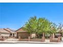 Lovely single-story home with gated front yard, desert landscaping, and two-car garage at 5453 Palisades Quad Ave, Las Vegas, NV 89122