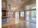 Bright living room featuring a high ceiling, recessed lighting, and large sliding glass doors at 601 Summer Mesa Dr, Las Vegas, NV 89144