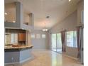 Open-concept living room featuring recessed lighting, large windows, and easy access to the kitchen at 601 Summer Mesa Dr, Las Vegas, NV 89144