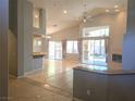 Spacious living room featuring recessed lighting, large windows, and a cozy fireplace at 601 Summer Mesa Dr, Las Vegas, NV 89144