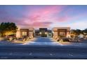 Beautiful single-story home with desert landscaping, stone facade, and modern lighting at 7966 W Ford Ave, Las Vegas, NV 89113