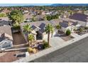 Lovely aerial view of single-story home with desert landscaping, tile roof, and mountain views at 8537 Highland View Ave, Las Vegas, NV 89145