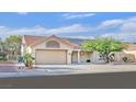 Charming single-story home featuring a well-maintained front yard and attached two-car garage at 8924 Signal Terrace Dr, Las Vegas, NV 89134