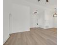 Bright living room featuring laminated floors and recessed lighting fixtures with high vaulted ceilings at 8924 Signal Terrace Dr, Las Vegas, NV 89134