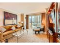 Cozy living room with comfortable sofa and views of the city at 145 E Harmon Ave # 1001, Las Vegas, NV 89109