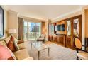 Comfortable living room with elegant furnishings and city views at 145 E Harmon Ave # 1001, Las Vegas, NV 89109