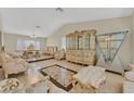 Spacious living area with tile flooring, ornate furnishings, and lots of natural light at 1517 Kirby Dr, Las Vegas, NV 89117
