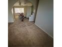 Bright living room features carpet floors and natural light at 217 Kola St, Henderson, NV 89015