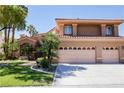 Charming two-story home boasts a well-manicured lawn and a spacious three-car garage at 2208 Fiero Dr, Las Vegas, NV 89134