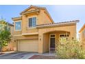 Inviting two-story home featuring a two-car garage and covered front porch at 2621 Rainbow Glow St, North Las Vegas, NV 89030