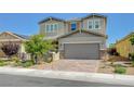 Charming two-story home featuring a manicured front yard and a spacious two-car garage at 2940 Duverney Ave, Henderson, NV 89044