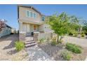 Well-manicured front yard with mature trees and a brick pathway leading to the entrance at 2940 Duverney Ave, Henderson, NV 89044