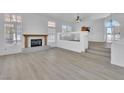 Spacious living room with fireplace, wood floors, and ample natural light at 3544 Mountain Valley Dr, Las Vegas, NV 89129