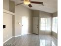 Spacious living room with tile floors, bright natural light, and neutral paint colors at 4021 Broadriver Dr, Las Vegas, NV 89108