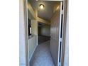 Open entryway leads into a living area with neutral colors, vaulted ceilings and a ceiling fan at 416 Richgold St, Henderson, NV 89012