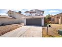 Two-story home featuring a gray exterior and a two-car garage at 4657 Curdsen Way, Las Vegas, NV 89110
