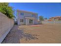 Large backyard with plenty of space for landscaping featuring a brick patio and block wall fence at 6042 Thorne Bay Ct, Las Vegas, NV 89110