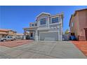 Two-story home featuring stucco exterior, covered front porch and an attached two car garage at 6042 Thorne Bay Ct, Las Vegas, NV 89110