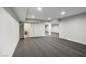 Large basement area with recessed lighting and neutral carpet, featuring doorways to other spaces at 7060 W Rome Blvd, Las Vegas, NV 89131