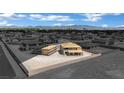 Aerial image of two houses under construction, surrounded by other houses in a monochromatic view at 7121 Painted Skyline St, Las Vegas, NV 89118