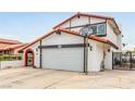 Charming two-story home featuring a well-maintained lawn, driveway, and Spanish style roof at 7384 Valhalla Ln, Las Vegas, NV 89123