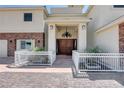 Grand entryway with a statement chandelier, decorative stone accents, and a welcoming pathway at 7590 Rancho Destino Rd, Las Vegas, NV 89123