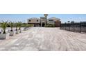 Expansive estate with a long driveway, landscaping, and a modern stucco exterior, great for curb appeal at 7590 Rancho Destino Rd, Las Vegas, NV 89123