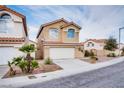 Charming two-story home with tile roof, desert landscaping, two car garage, and mature palm tree at 7816 Calico Flower Ave, Las Vegas, NV 89128
