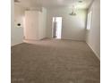 Large living room features carpet, white walls, and lots of space at 8756 Shady Pines Dr, Las Vegas, NV 89143