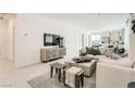 Bright and spacious living room featuring contemporary furniture and décor at 9351 Aria Ridge Ave, Las Vegas, NV 89143