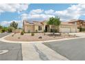 Beautiful single-story home featuring a three-car garage, desert landscaping, and a tile roof at 9410 Stone Castle Way, Las Vegas, NV 89123