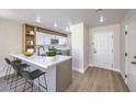 Stylish kitchen boasts a breakfast bar, modern countertops, and stainless steel appliances at 1097 Paradise Resort Dr, Henderson, NV 89002