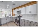 Contemporary kitchen featuring stainless steel appliances, stylish lighting, and modern countertops at 1097 Paradise Resort Dr, Henderson, NV 89002