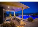 Outdoor kitchen with grill, bar seating and a view at 11248 Rebel Dome Ct, Las Vegas, NV 89141