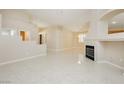 Spacious living room with tile flooring and a cozy fireplace feature at 1311 Rolling Sunset St, Henderson, NV 89052