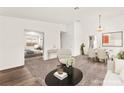 Open-concept living and dining space, showcasing stylish furnishings and access to the bedroom at 1405 Wintergreen Dr, Las Vegas, NV 89128