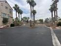 Gated community entrance with palm trees offering security and exclusivity at 1512 Couples St, Las Vegas, NV 89128